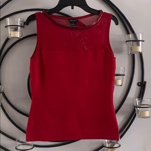 Red sleeveless shirt. Size M sequins around collar